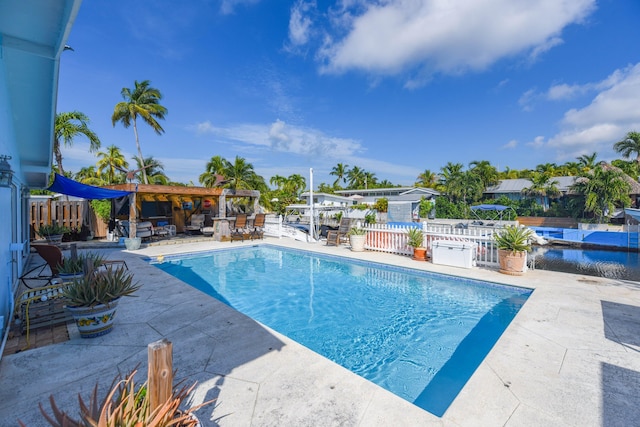 view of swimming pool with a patio area