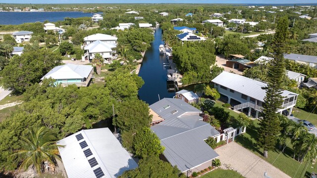 aerial view featuring a water view and a residential view