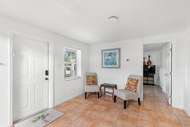 living area with light tile patterned flooring