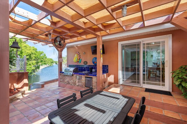 view of patio with a pergola and area for grilling