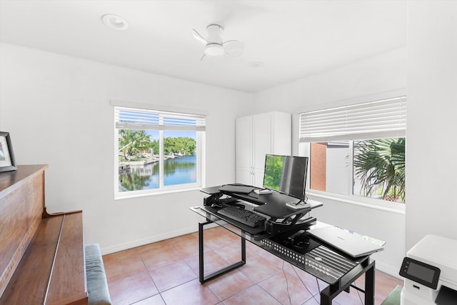 home office featuring baseboards and light tile patterned flooring