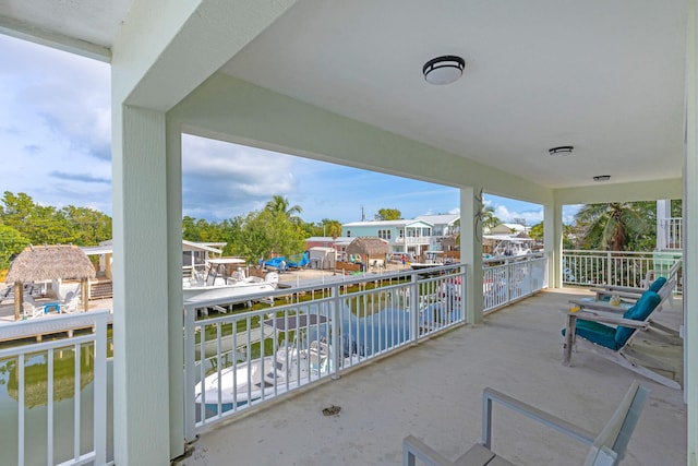 balcony featuring a water view