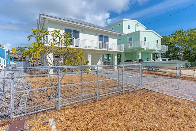 rear view of property with a balcony