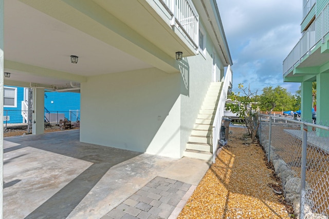 view of side of home featuring a carport