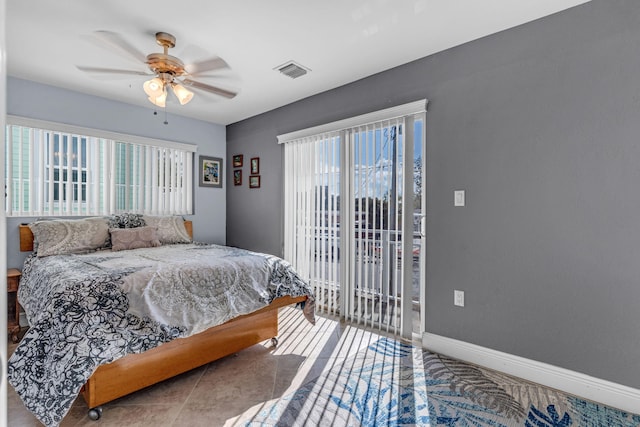 bedroom with multiple windows, access to exterior, and ceiling fan