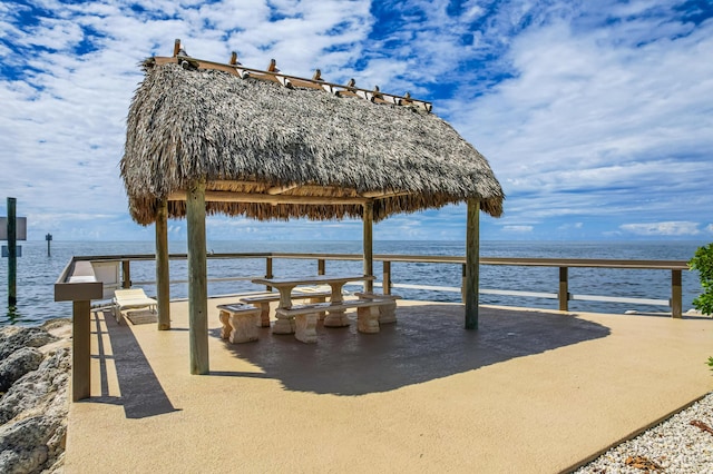 dock area with a gazebo and a water view