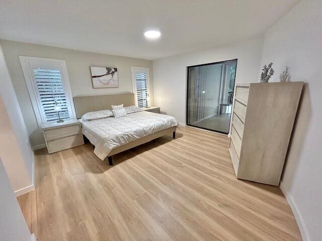 bedroom with light hardwood / wood-style flooring