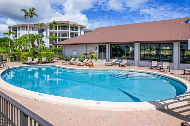 view of swimming pool with a patio