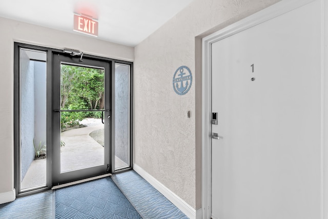 entryway with hardwood / wood-style flooring