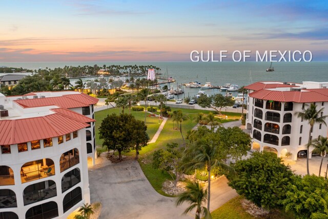 aerial view at dusk with a water view