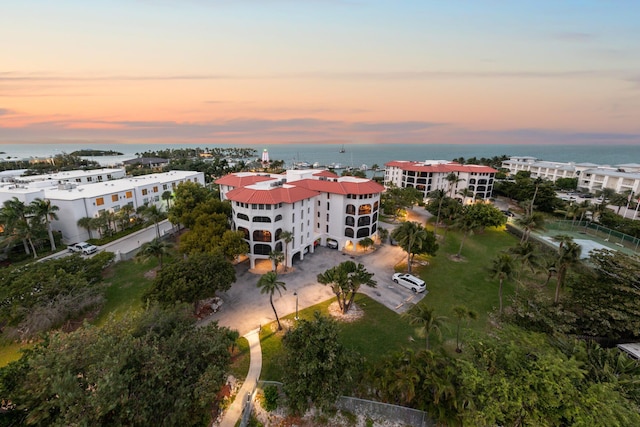 aerial view at dusk with a water view