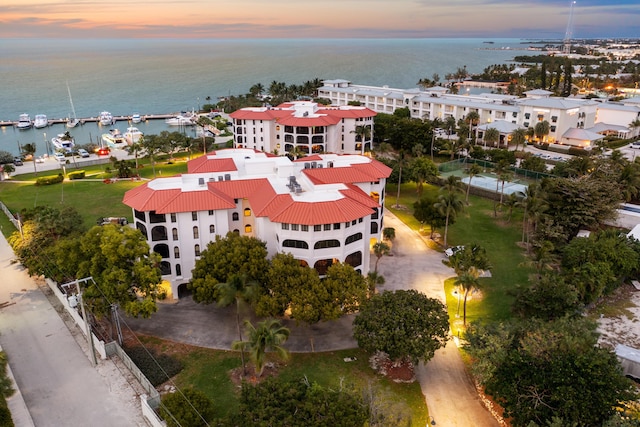 aerial view at dusk with a water view