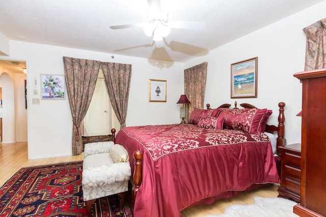 bedroom with hardwood / wood-style flooring and ceiling fan