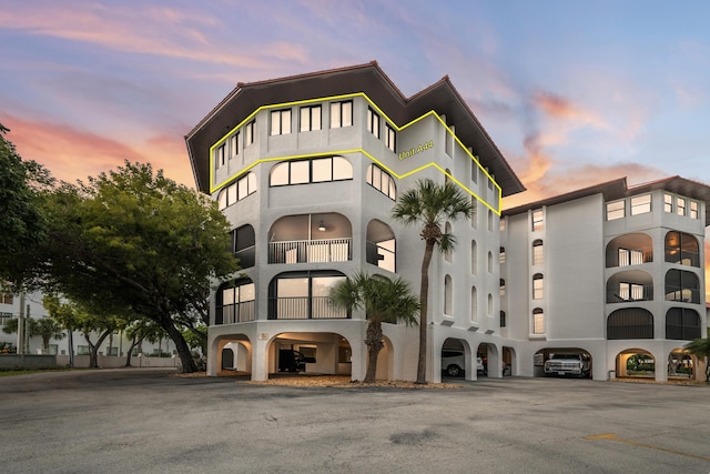 view of outdoor building at dusk