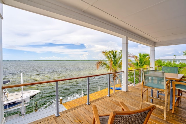 1777 Pine Channel Dr, Little Torch, FL 33042 - wooden terrace with a water view and outdoor dining space