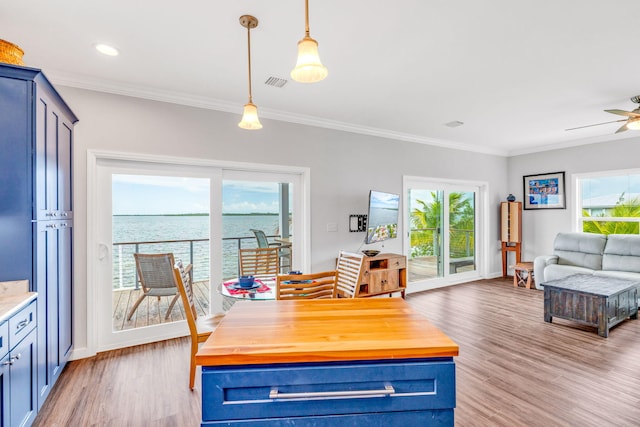 1777 Pine Channel Dr, Little Torch, FL 33042 - dining space featuring light wood finished floors, ornamental molding, and a ceiling fan