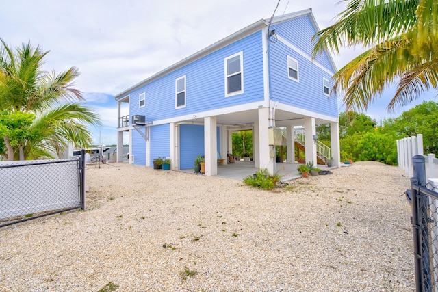 1777 Pine Channel Dr, Little Torch, FL 33042 - back of property featuring a carport, stairs, and driveway