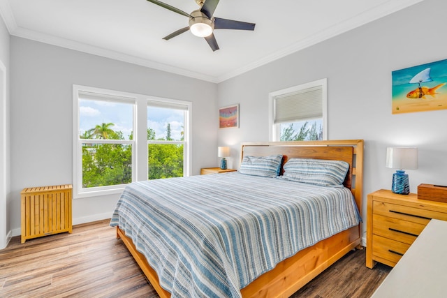 1777 Pine Channel Dr, Little Torch, FL 33042 - bedroom with radiator heating unit, ornamental molding, wood finished floors, and a ceiling fan