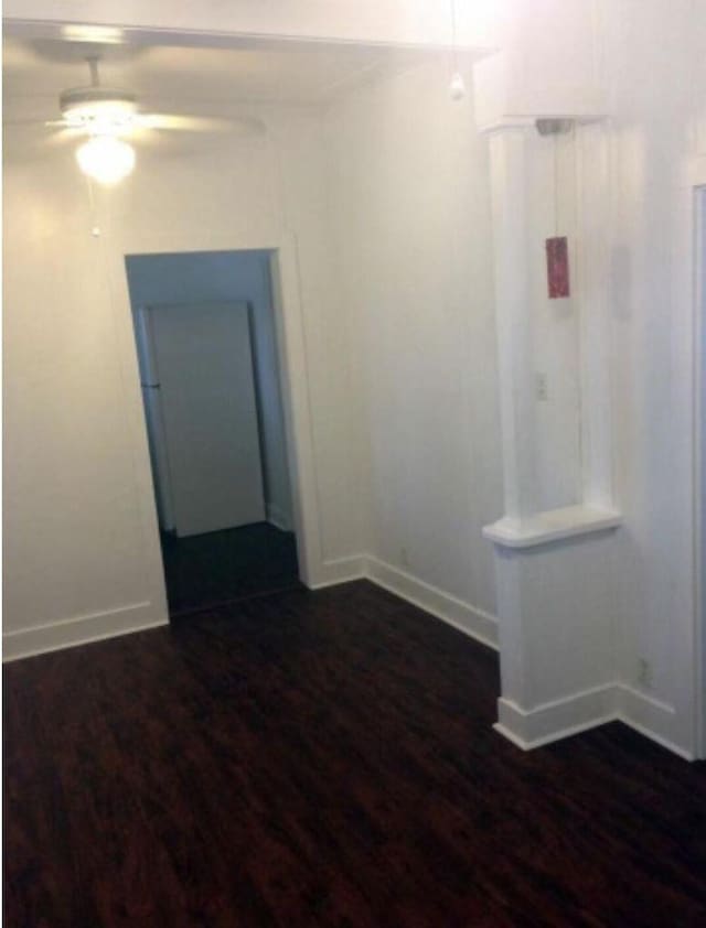 1122 Simonton St, Key West, FL 33040 - unfurnished room with ceiling fan, dark wood finished floors, and baseboards