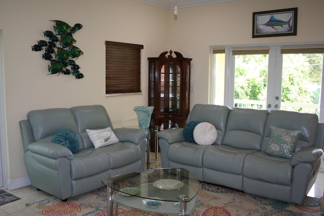 living room with french doors and light tile patterned floors