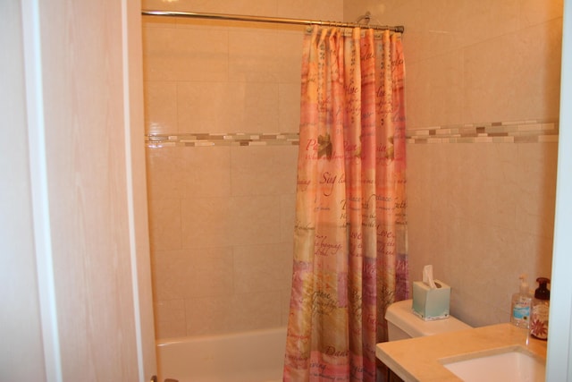 full bathroom featuring vanity, toilet, and shower / tub combo