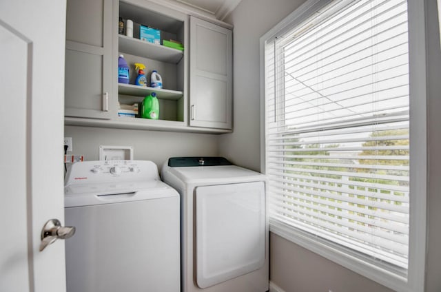 laundry area with cabinets and washer and dryer