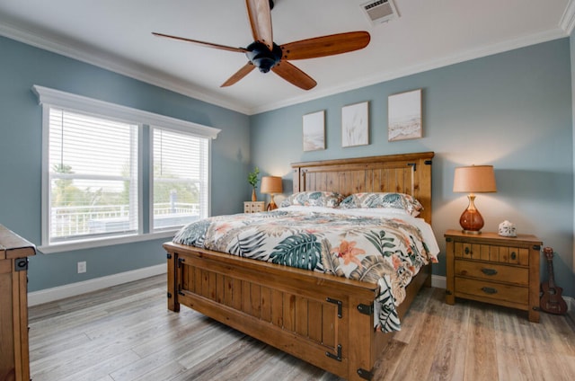 bedroom with crown molding, ceiling fan, and light wood-type flooring