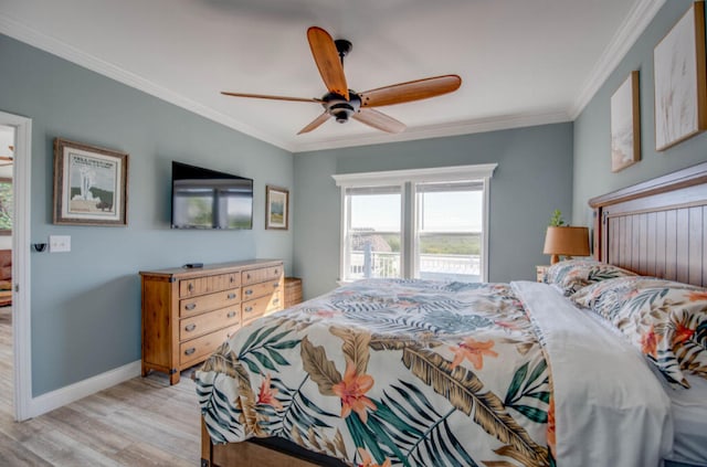 bedroom featuring ornamental molding, ceiling fan, and light wood-type flooring