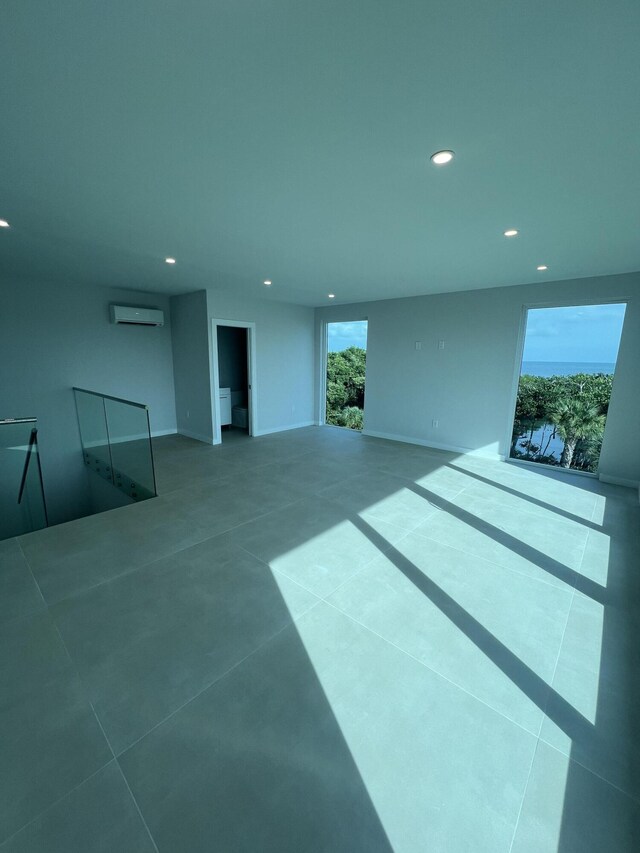 94825 Overseas Hwy Unit 253, Key Largo, FL 33037 - unfurnished living room featuring a wall mounted AC