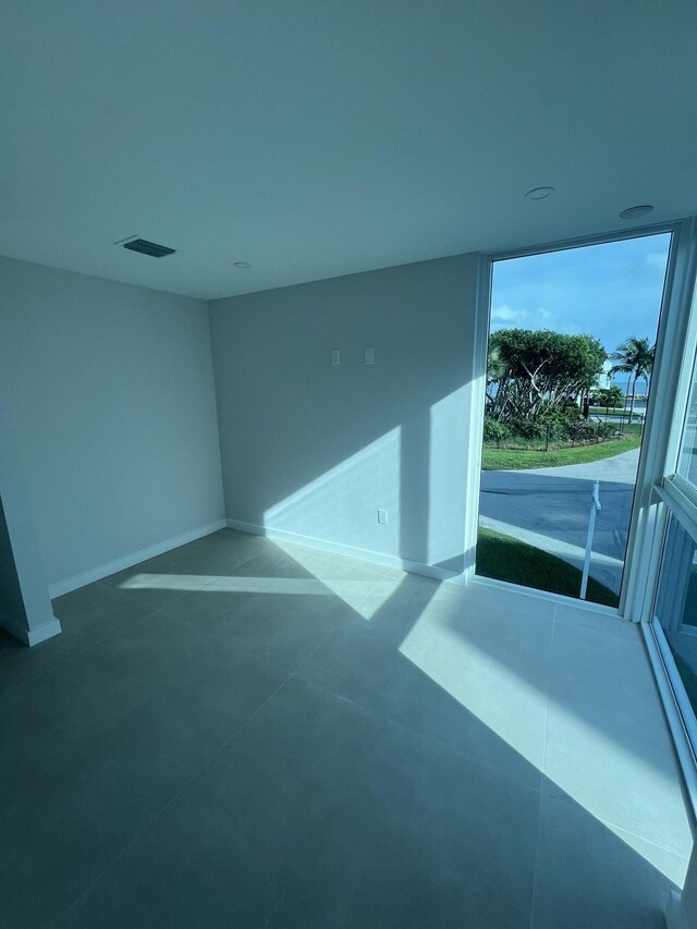 unfurnished room featuring concrete flooring