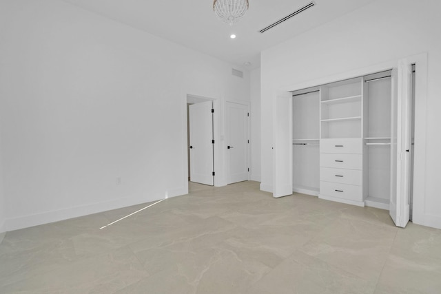unfurnished bedroom with a notable chandelier, recessed lighting, and visible vents