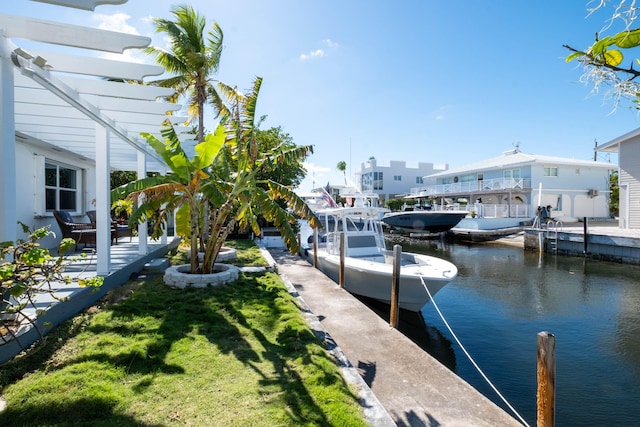 dock area with a yard, a water view, and a pergola