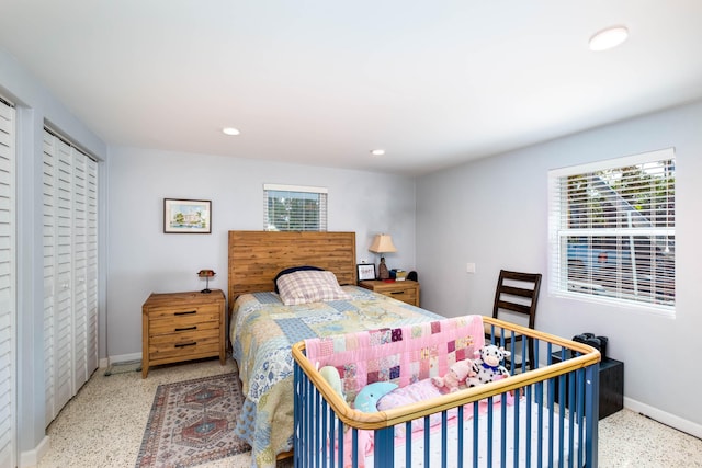 bedroom featuring recessed lighting, speckled floor, and baseboards