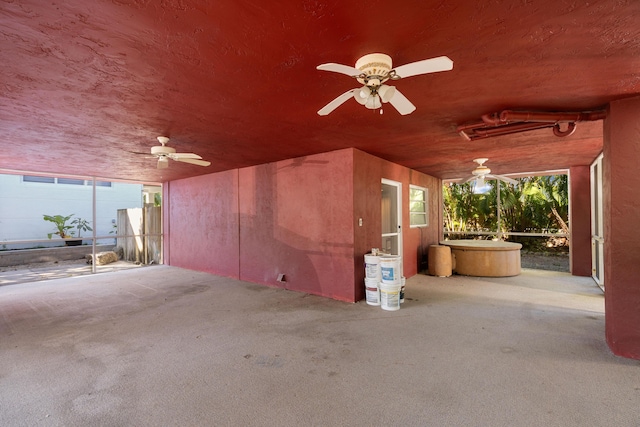 view of patio / terrace featuring a hot tub and ceiling fan