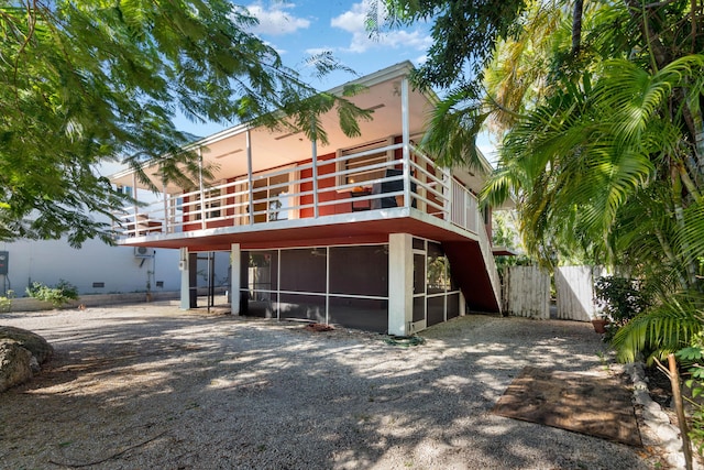 back of property featuring a sunroom