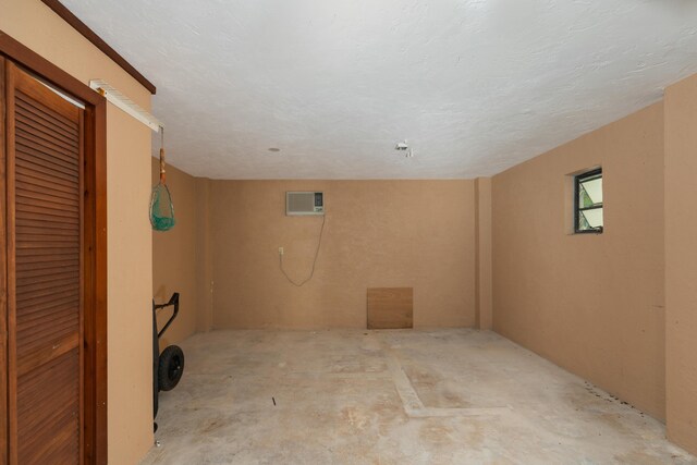 interior space with a wall mounted air conditioner