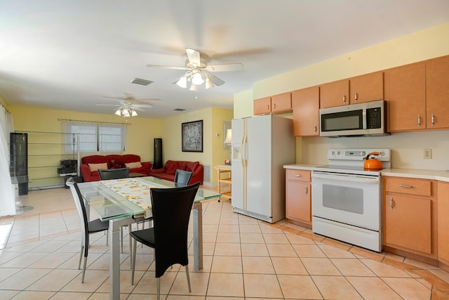 kitchen with ceiling fan, white appliances, and light tile patterned floors