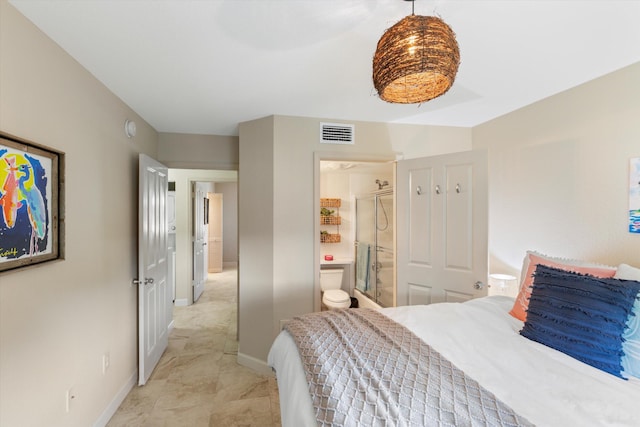 64 Seaside N Ct, Key West, FL 33040 - bedroom featuring baseboards and connected bathroom