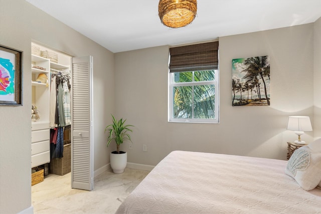 64 Seaside N Ct, Key West, FL 33040 - bedroom with a spacious closet, a closet, and baseboards