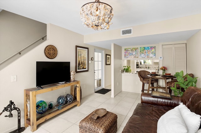 64 Seaside N Ct, Key West, FL 33040 - living room with a chandelier and light tile patterned flooring