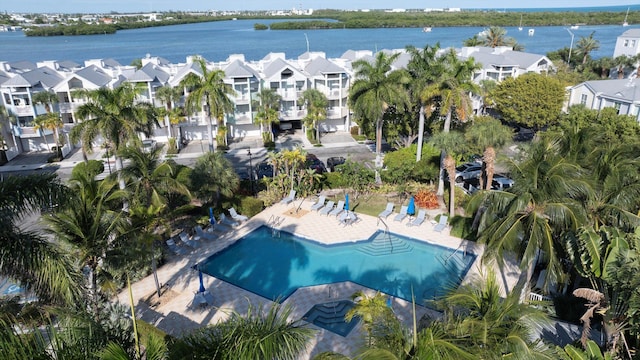64 Seaside N Ct, Key West, FL 33040 - aerial overview of property's location with nearby suburban area, a pool, and a large body of water