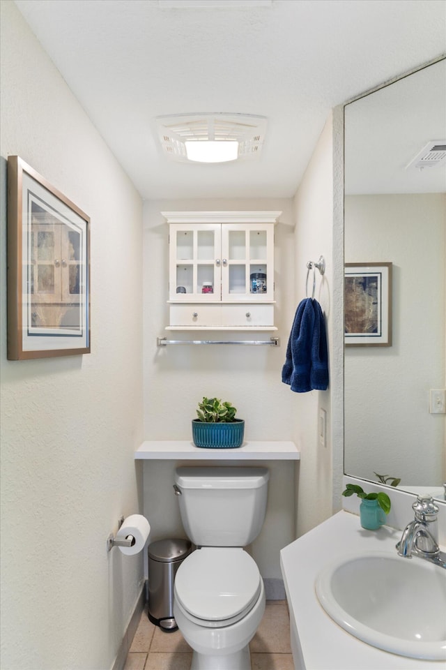 64 Seaside N Ct, Key West, FL 33040 - bathroom featuring toilet, vanity, tile patterned floors, and baseboards