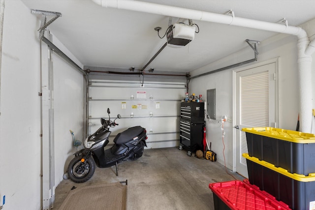 64 Seaside N Ct, Key West, FL 33040 - garage featuring electric panel and a garage door opener