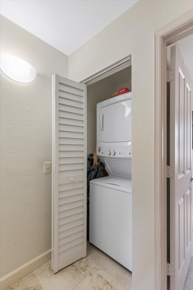 64 Seaside N Ct, Key West, FL 33040 - laundry area featuring stacked washer / dryer