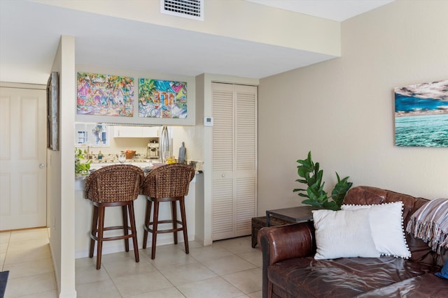 64 Seaside N Ct, Key West, FL 33040 - living area featuring light tile patterned flooring and baseboards
