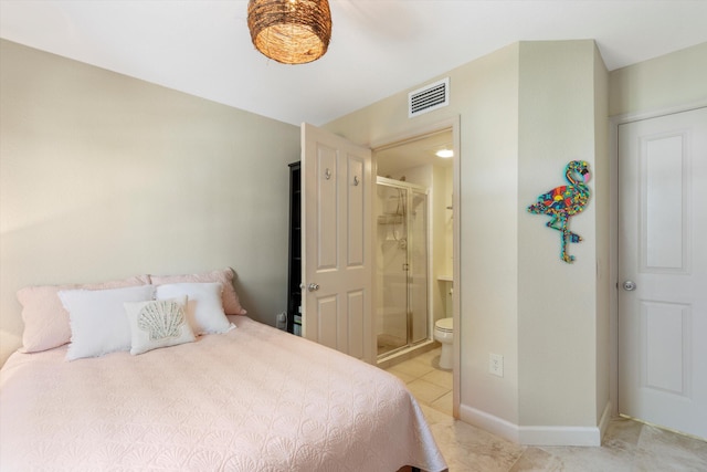 64 Seaside N Ct, Key West, FL 33040 - bedroom featuring light tile patterned floors, connected bathroom, and baseboards