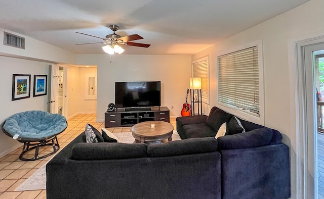 living room with light tile patterned flooring and ceiling fan