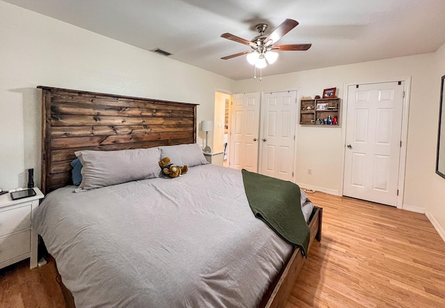 bedroom featuring ceiling fan and light hardwood / wood-style floors