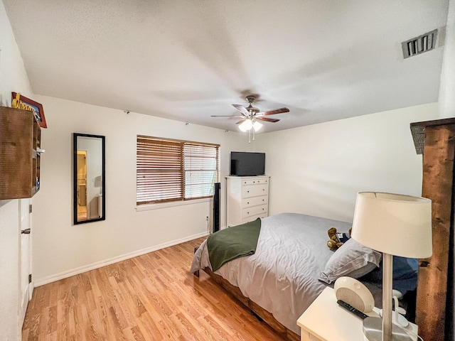 bedroom featuring ceiling fan and light hardwood / wood-style floors