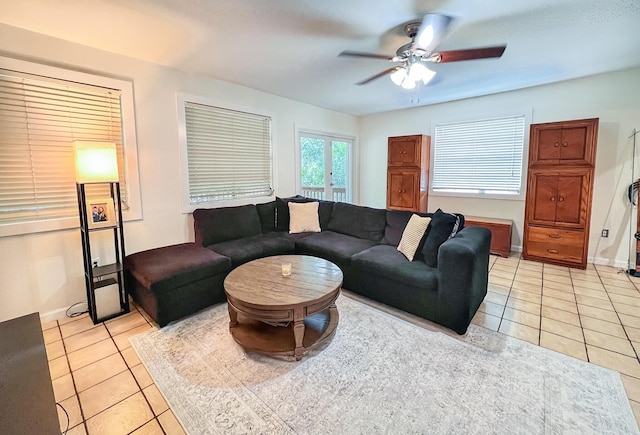 tiled living room featuring ceiling fan